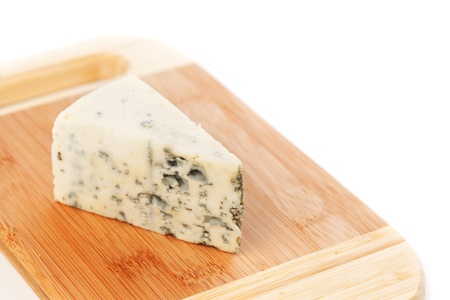 Blue cheese on wood plateの写真素材
