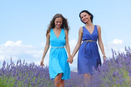 two women on lavender fieldの写真素材