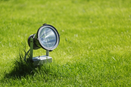 Garden lamp on background of green grassの写真素材