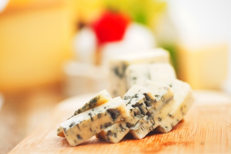 Blue cheese on wood plateの写真素材