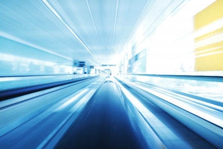 Blurred backround of moving futuristic escalatorの写真素材