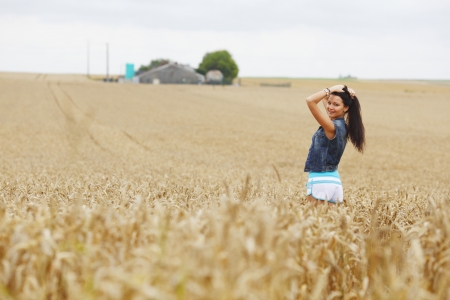 woman on wheat fieldの写真素材