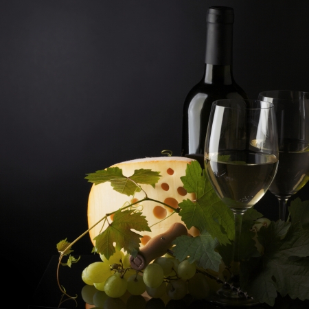 white wine and cheese on blackの写真素材