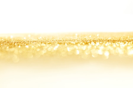Abstract golden shiny holidays lights backgroundの写真素材
