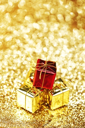 Christmas gift boxes on shiny background close-upの写真素材