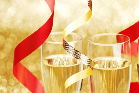New year champagne and ribbons on golden の写真素材