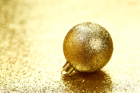 Christmas ball on golden background close-upの写真素材