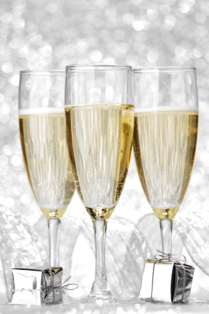 Beautiful silver christmas card with champagne and giftの写真素材