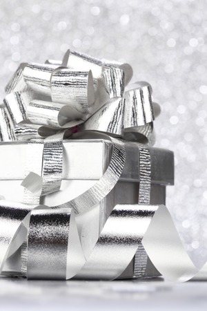 Christmas gift box with decoration on shiny backgroundの写真素材