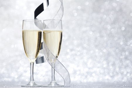 New year card with Champagne on shiny glitter backgroundの写真素材