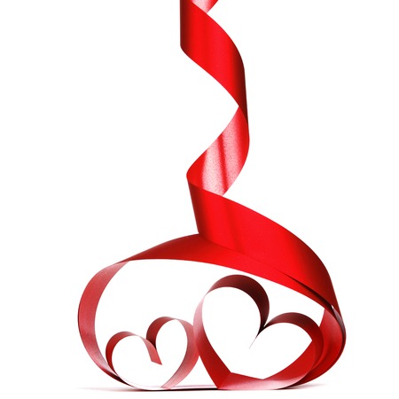 Ribbons shaped as hearts on white, valentines day conceptの写真素材