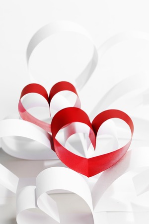 Valentines day card with paper and ribbon hearts on whiteの写真素材