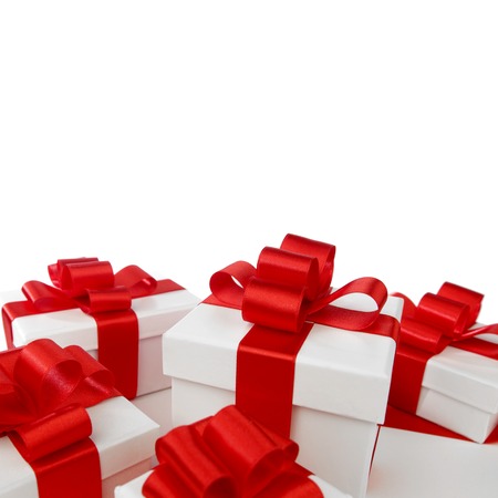 Gift boxes with red ribbon bows on white 