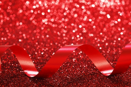 Red ribbon on glitter backgroundの写真素材