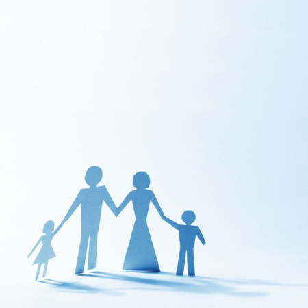 Paper family linked together over light backgroundの写真素材