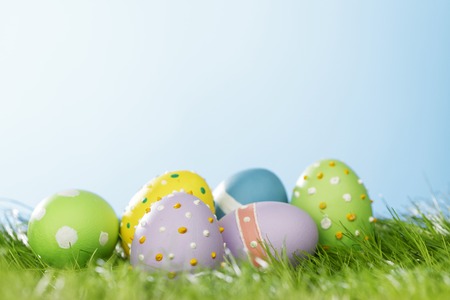 Decorated easter eggs in spring green grass