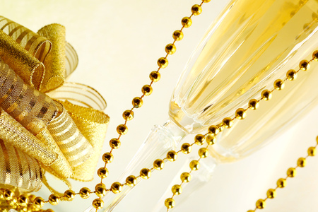 New year champagne glasses and golden decorationの写真素材