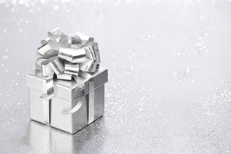 Beautiful holiday gift box decorated with silver bow