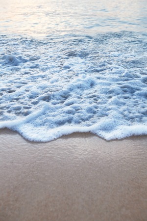 Natural background with wave coming to sandy beach