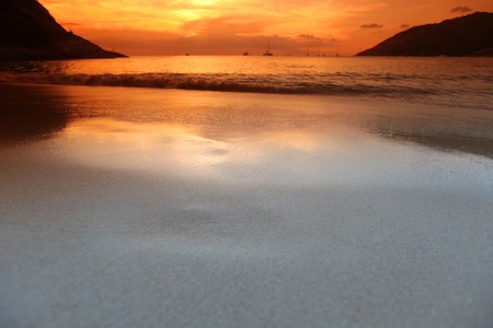 Beautful landscape with sea beach and mountains under sunset sky in Thailandの写真素材