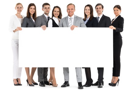 Full length portrait of business team holding blank billboard isolated on white backgroundの写真素材