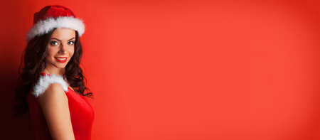 Portrait of beautiful sexy girl wearing santa claus clothesの写真素材