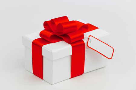 One Holiday gift with tag on white backgroundの写真素材