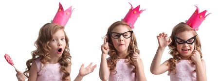 Beautiful little candy princess girl in crown bat mask, on fake glasses, with lollipop, halloween costume conceptの写真素材