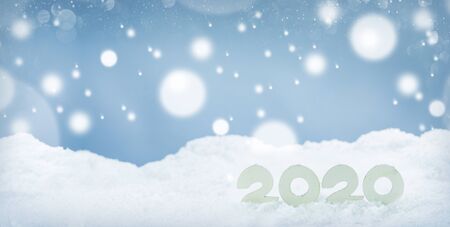 2020 New Year design concept. Wooden 2020 New Year horizontal template on snow on white bokeh...