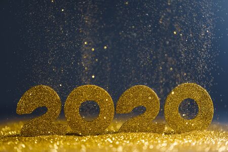 2020 New Year luxury design concept. Golden 2020 New Year horizontal template with golden glitter on...