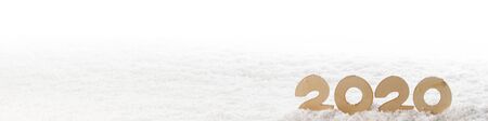 Wooden Number 2020 in the snow , Happy New Year's concept isolated on white backgroundの写真素材