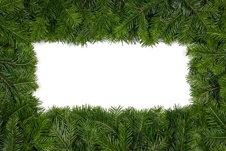Christmas border arranged with fresh fir branches isolated on white background , copy space for textの写真素材