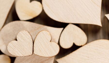 Many wooden colorless hearts backgroundの写真素材