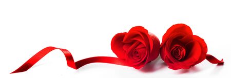 Hearts of red roses and curly ribbons isolated on white background Valentines day designの写真素材