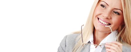 Business woman in glasses isolated on white background, happy and smiling, biting her eyeglasses, close up portrait, copy spaceの写真素材