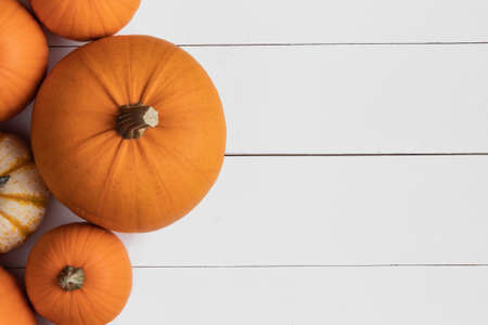 Many orange pumpkins on wooden background, Halloween concept, top view with copy spaceの写真素材