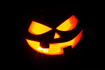 Jack O Lantern halloween pumpkin face isolated on black backgroundの写真素材
