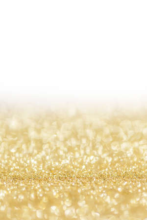 Shiny golden bokeh glitter lights abstract background, Christmas New Year party celebration concept