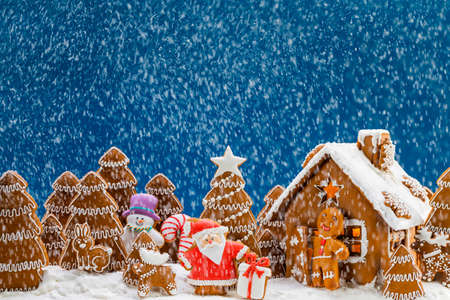 Gingerbread house christmas fir trees Santa Claus and gift cookies winter holiday celebration...