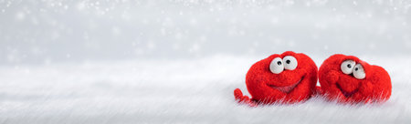 Two toy red hearts on white fur background with copy space for text, symbol of love, healtcare,...