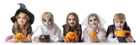 Group of children in fancy Halloween costume dress isolated on white background, going trick or treatingの写真素材