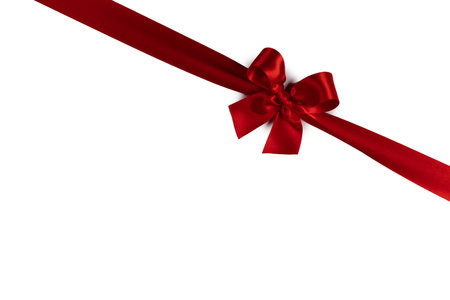 Red satin ribbon bow isolated on white backgroundの写真素材