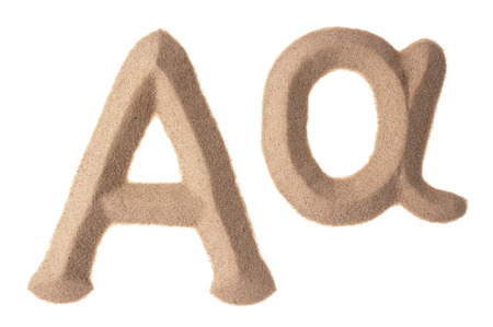 Upper and lowercase of Greek Alpha sign sculptured in sandの写真素材