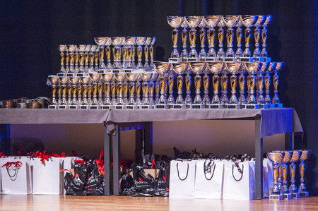 MAASTRICHT, THE NETHERLANDS - OCTOBER 25, 2015: Table of thophies and goodie bags at championship at the World Grandprix Bodybuilding and Fitness of the WBBF-WFF on October 25, 2015 at the MECC Theatre in Maastricht, the Netherlands.のeditorial素材