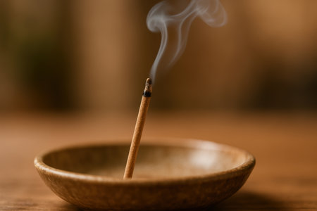 Orthodox religious incense burning in ceramic holder, rising fragrant smoke during ritual symbolizing purification and spiritual tradition.の素材