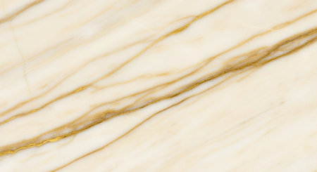 Elegant white and beige marble surface with natural golden veining texture for interior design and decoration.の素材