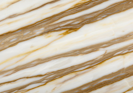 Close up of polished marble surface with natural brown and white veins and smooth texture.の素材