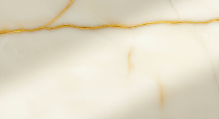 Elegant ivory marble surface with natural gold veining and soft sunlight, perfect for modern luxury interiors and design accents.の素材
