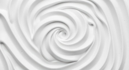 Smooth creamy swirl pattern in white color, abstract textured background with concentric circular movement and soft curves.の素材