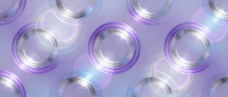 Iridescent metallic circular rings arranged in a pattern with soft purple gradients and bright light reflections.の素材
